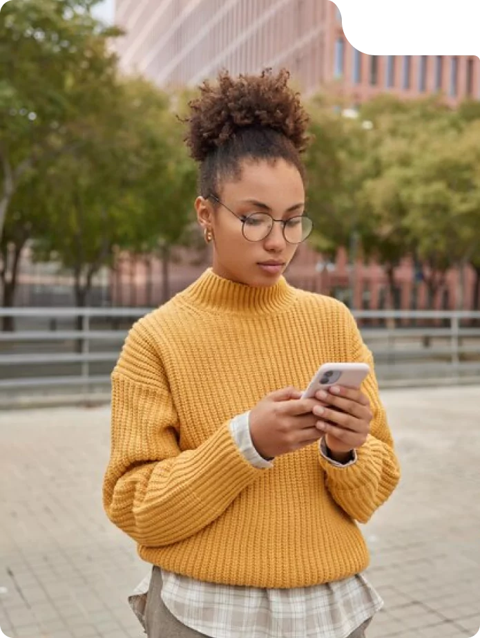 a woman looking at a phone